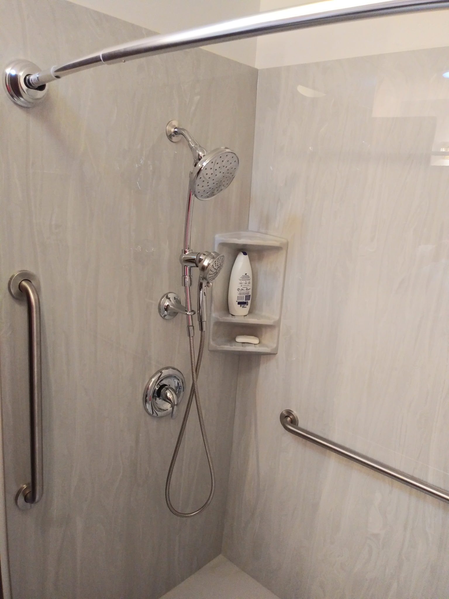 Handheld shower, lever control, wall niche and vertical grab bar in Nathan's shower project